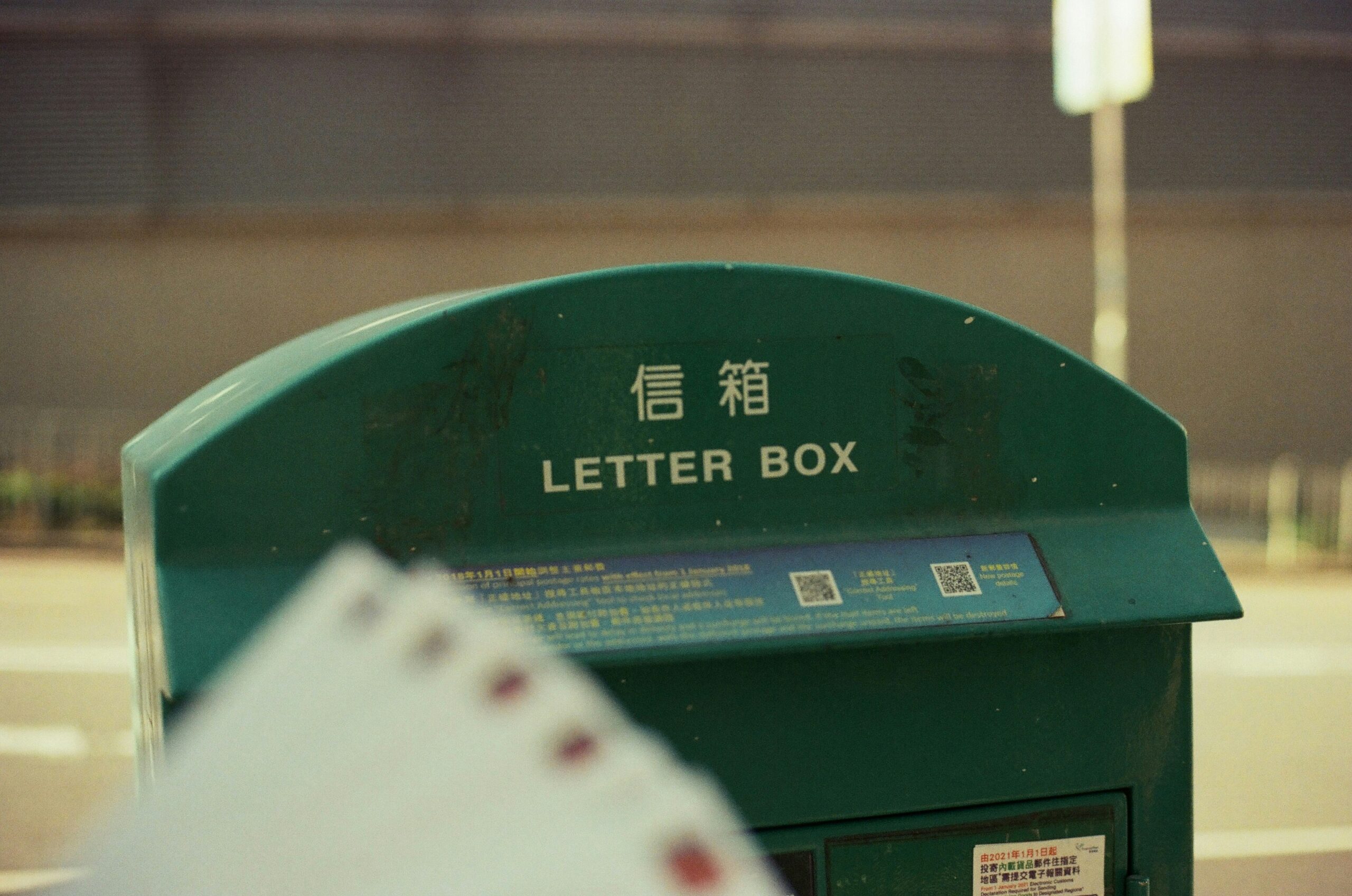 a green box with a lot of cards in it