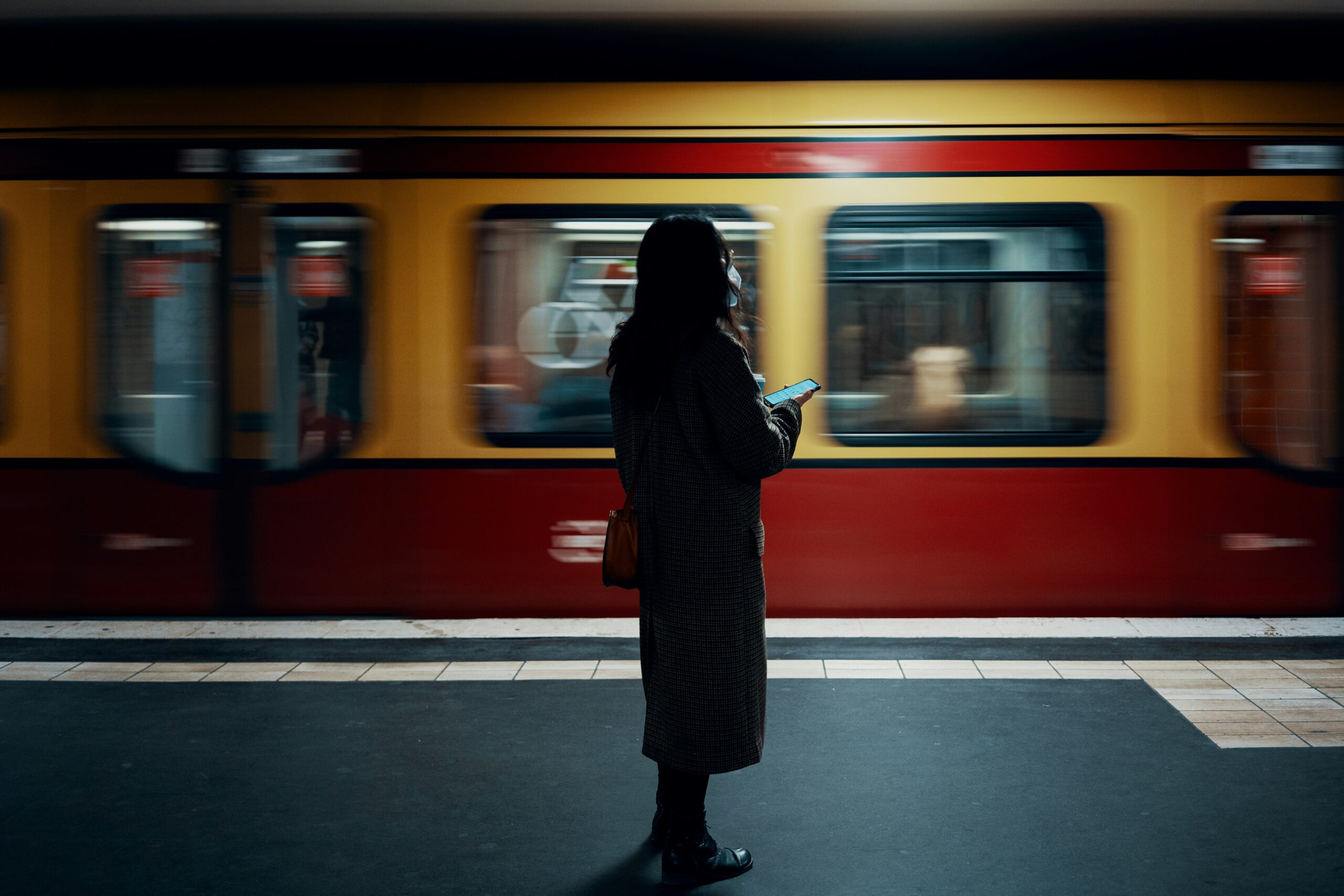 지하철 종결자 – Smarter Subway, a woman standing in front of a train at a train station